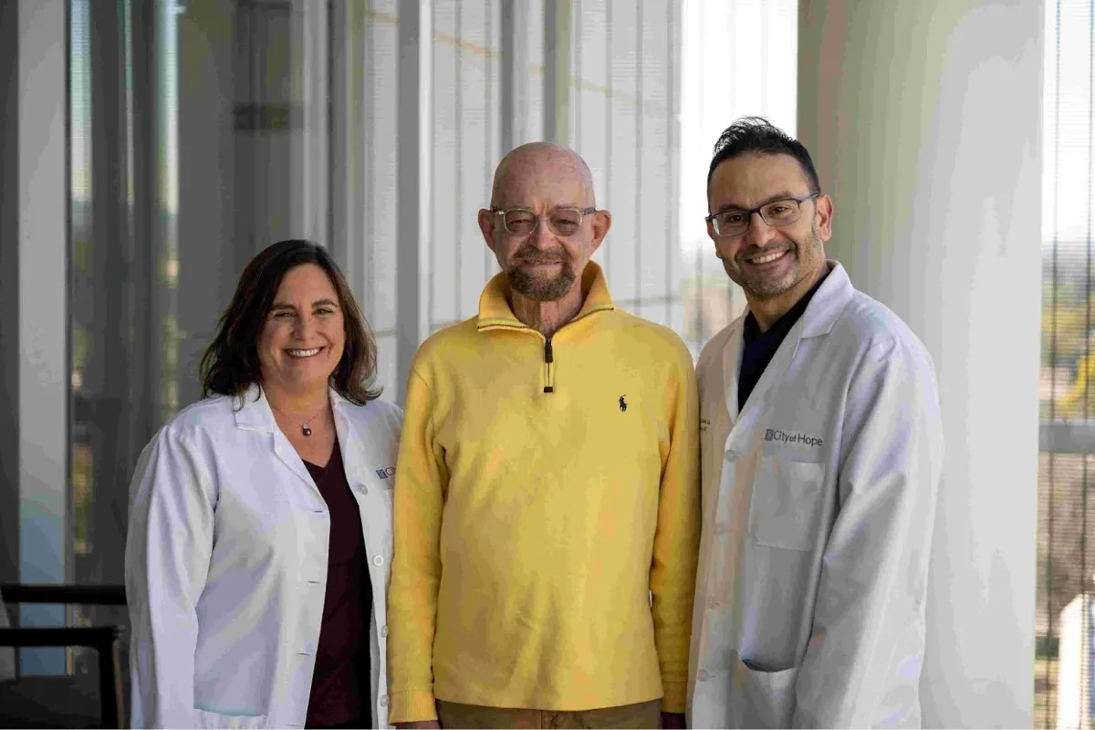 Paul Edmonds (center) with doctors Jana K. Dickter and Monzr M. Al Malki from City of Hope