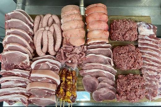 Raw meat and sausage in a display; illustrative archive photograph.
