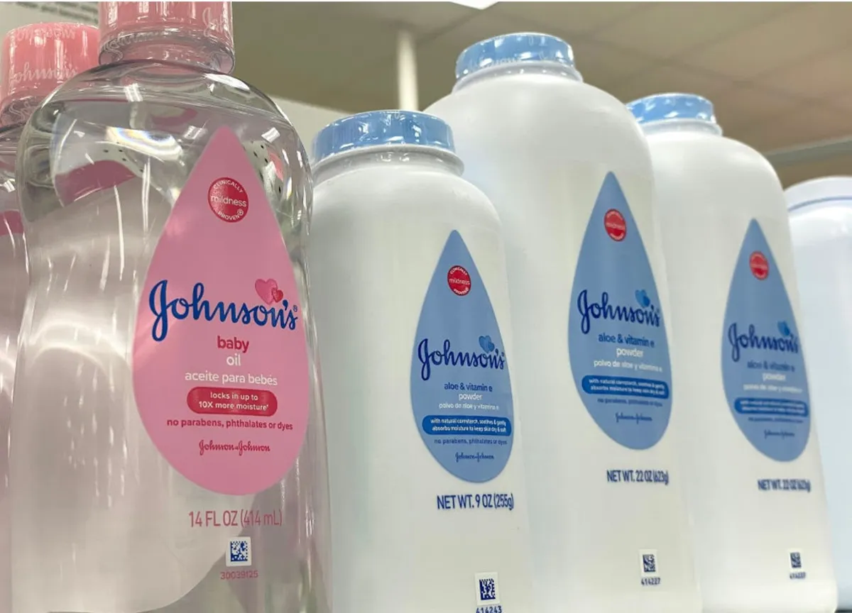 Numerous products, including talc powder from J&J, sit on a supermarket shelf