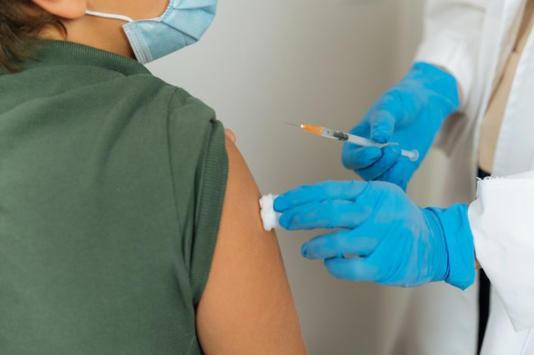A person receiving an injection; illustrative archive health-care photograph.