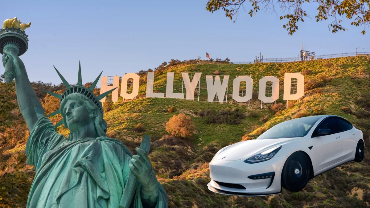 A view of the Hollywood sign with the statue of liberty and a white tesla in frame