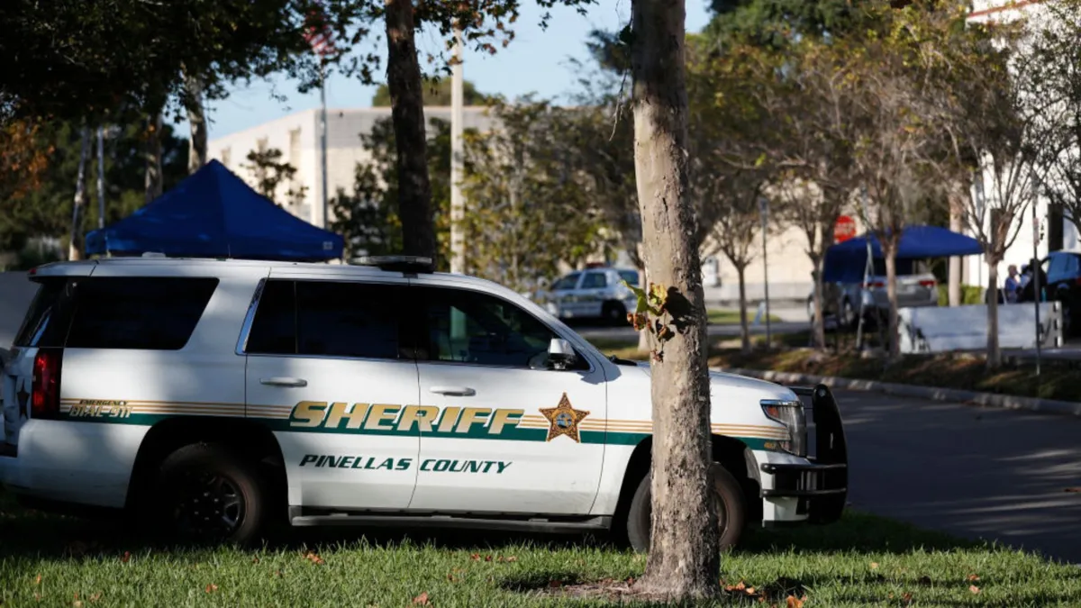 A white Sheriff vehicle parked next a street