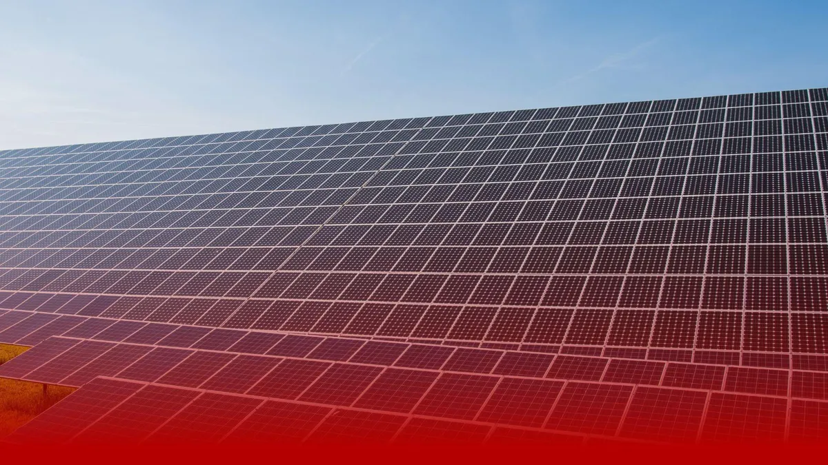 A picture of hundreds of solar panels/A red blurred line