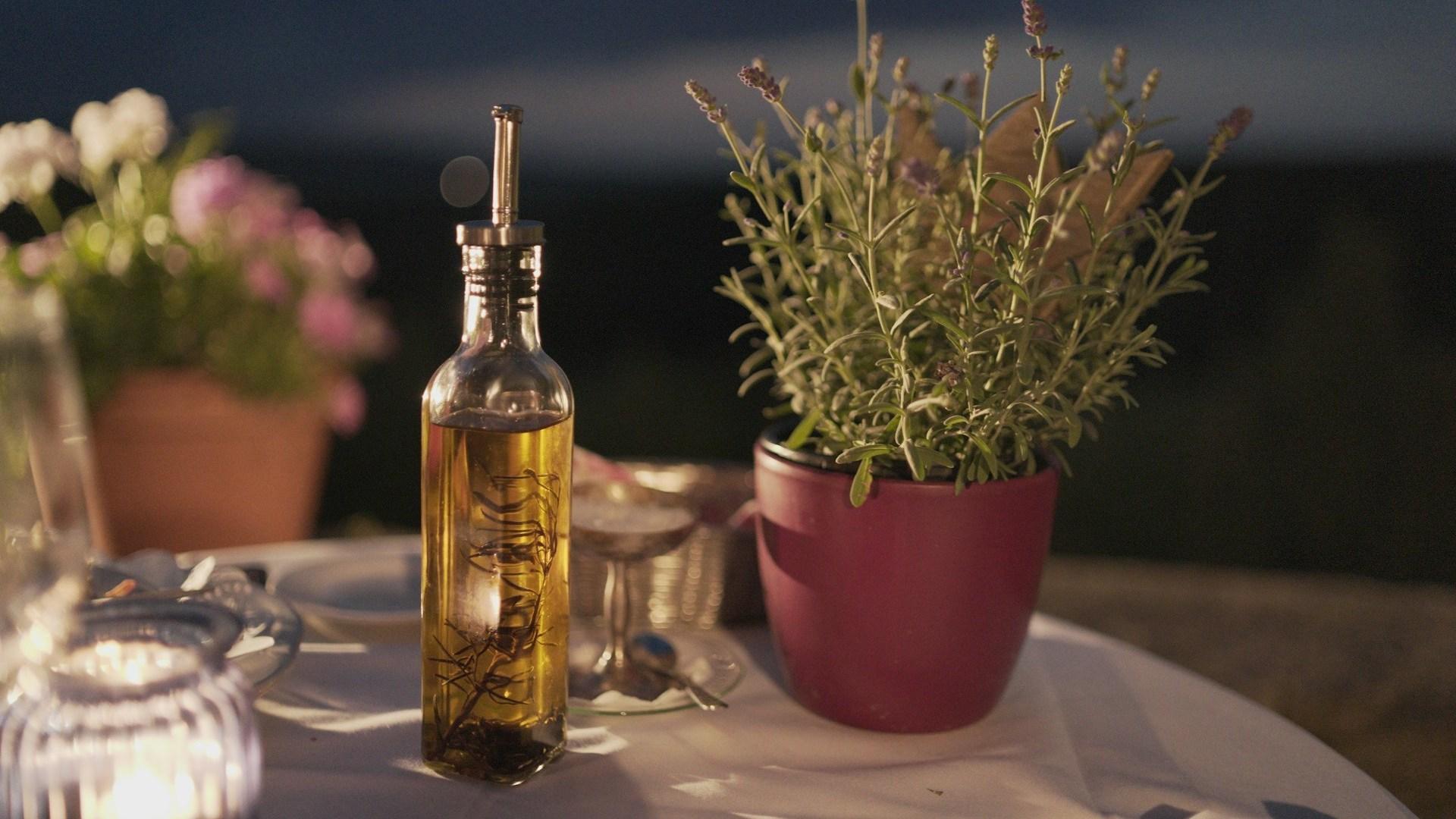 Olive oil on a table; illustrative archive photograph.